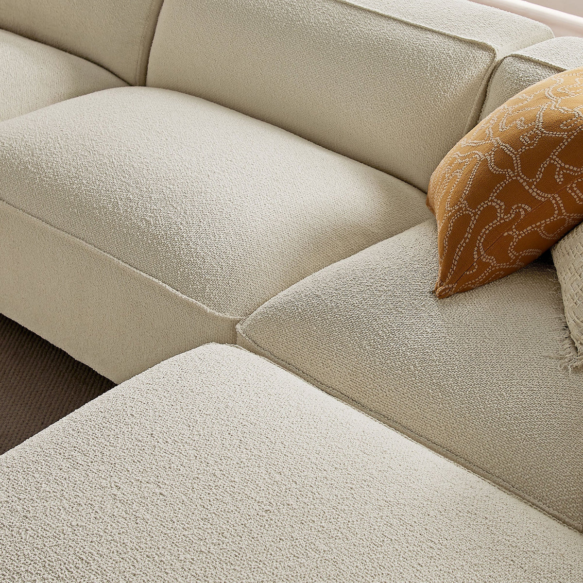 Canapé modulaire Auren 4 pièces en bouclette, motif treillis, avec pouf